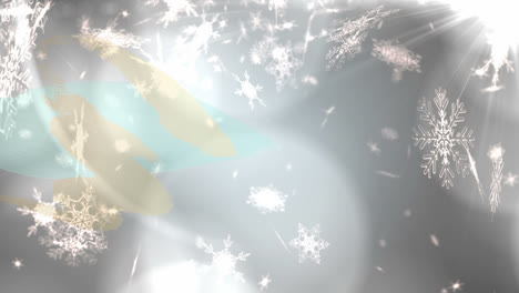 animation of christmas snow falling over glowing lights and grey background