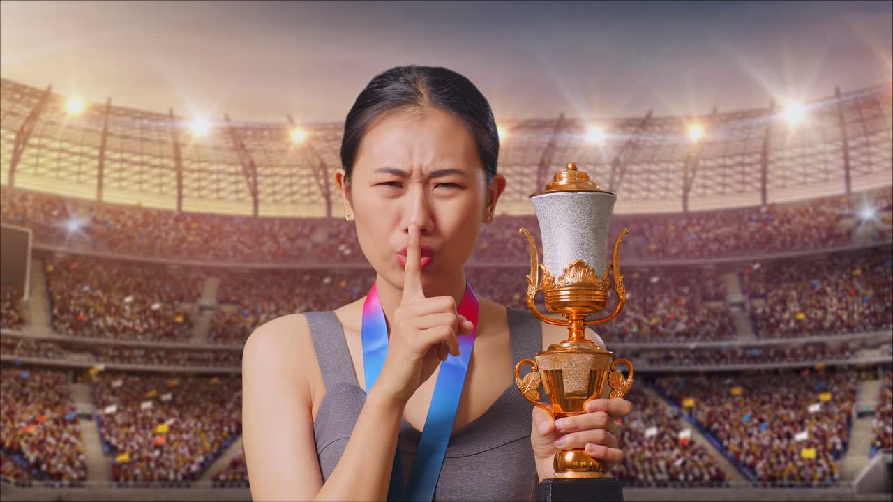 Athlete with Trophy and Medal in Stadium