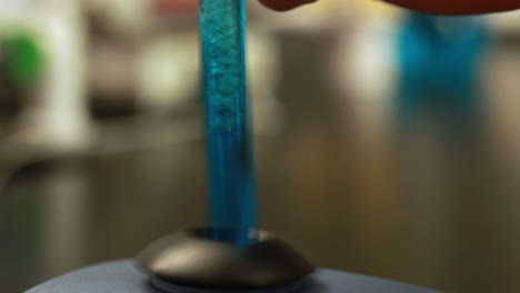 scientist mixing test tube with centrifuge