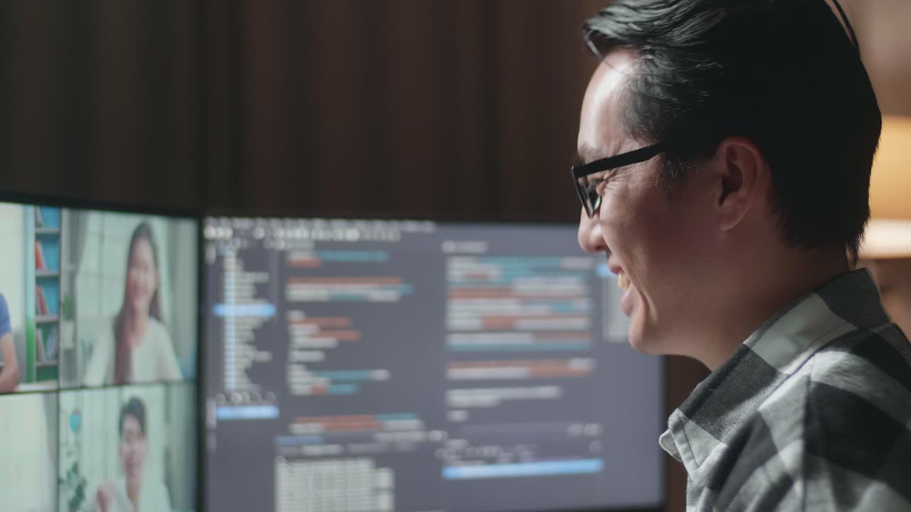 Man in video meeting while coding