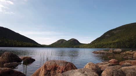 scenic jordan pond with its rocky shore, acadia national park, maine, usa, static low-angle late afternoon shot