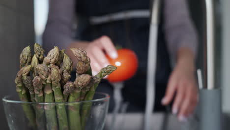 woman washes ingredients for salad