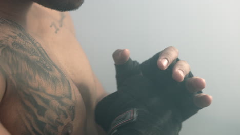 fighter boxing bandage. boxer strikes. closeup of fighter preparing boxing match