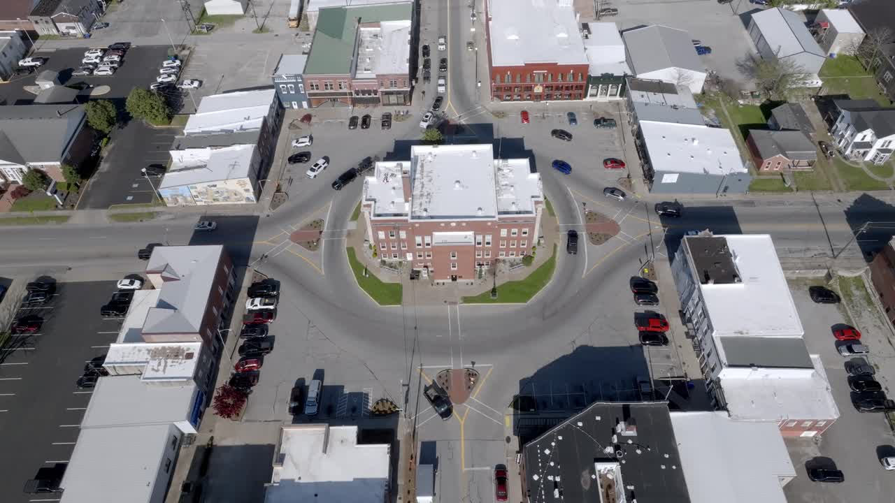 Leitchfield, Kentucky downtown with vehicles driving and drone video stable.