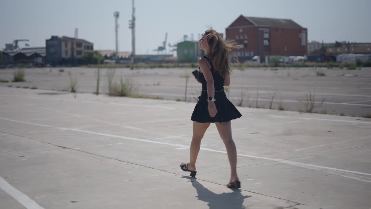 Young Woman Walking in Urban Parking Lot