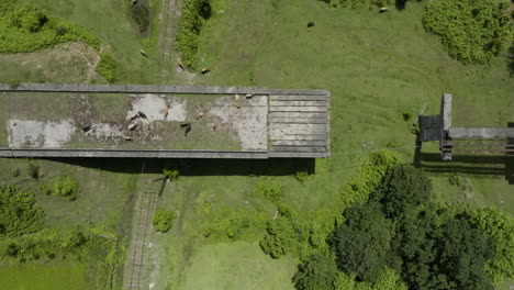 aerial shot of desolated, unfinished bridge doomed to be destroyed by time