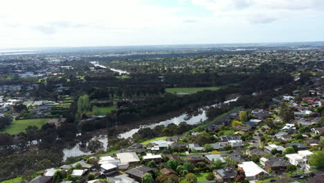 AERIAL-Dolly-Back,-Flooded-Barwon-River-Geelong-Australia