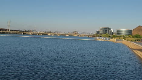 light rail cars crossing bridge at tempe town lake in tempe, arizona