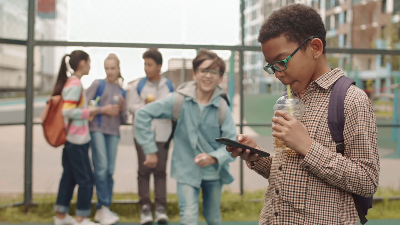 School Boys with Smartphone at Playground