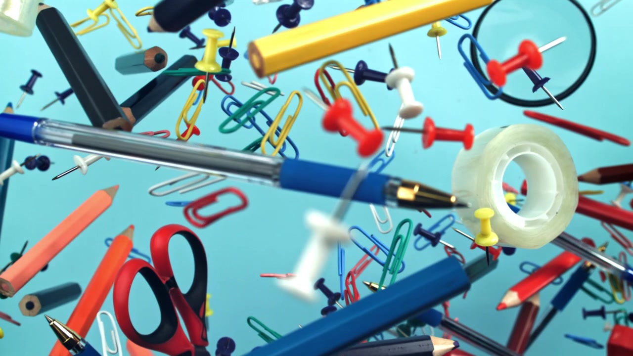 Colorful Office and School Supplies Floating in Slow Motion