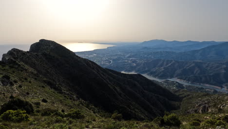 4k-Static-shot-of-a-mountain-side-in-the-shadows-at-La-Concha,-Marbella,-Spain