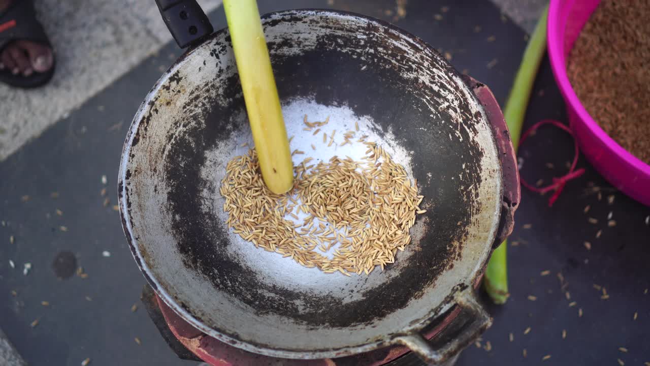 The process of making traditional Thai desserts using large wooden mortars.