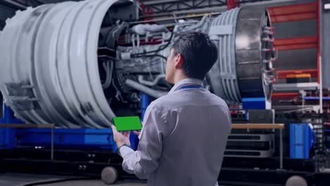 engineer reviewing a digital twin of a jet engine
