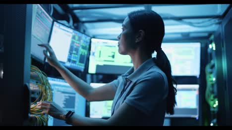 a focused technician in a high-tech server room: managing complex systems amidst glowing screens and data streams