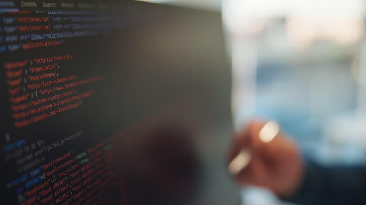 Developer Working on Code on a Computer Screen