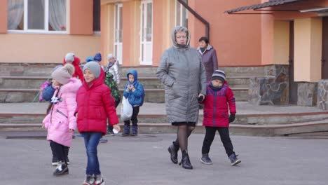 school children walking with teacher