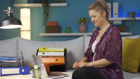 Home-office-worker-woman-happy-and-smiling.