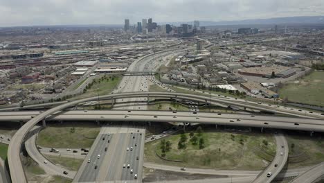 Aerial-Highway-Traffic-Loop-with-pan-to-city