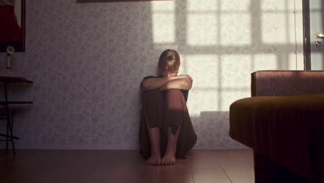 woman sitting on floor in a room