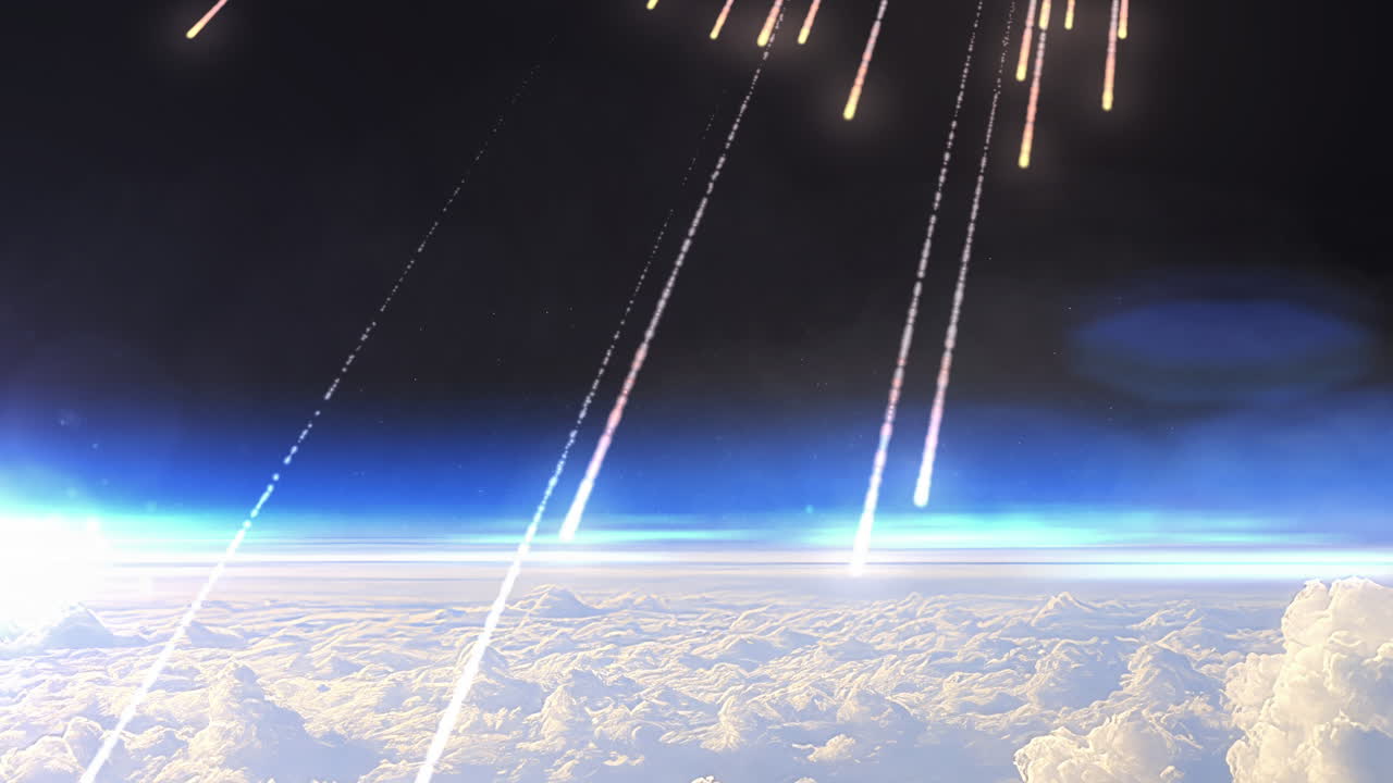 Glowing meteors falling above the clouds