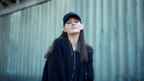 girl standing on street. portrait of stylish woman posing at camera