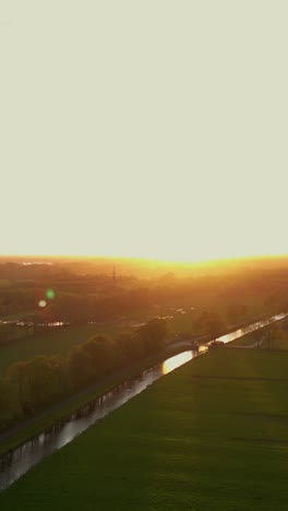 sunset over dutch canal landscape