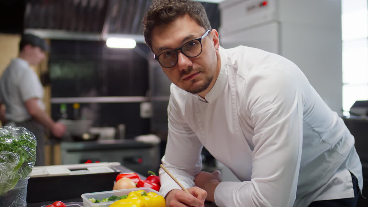 Portrait of Professional Chef at Work in Restaurant Kitchen