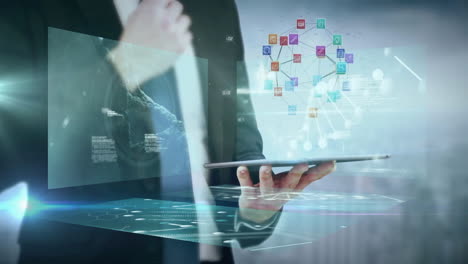 Using tablet, business professional viewing animation with digital data overlay