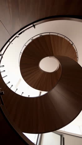 wooden spiral staircase viewed from below