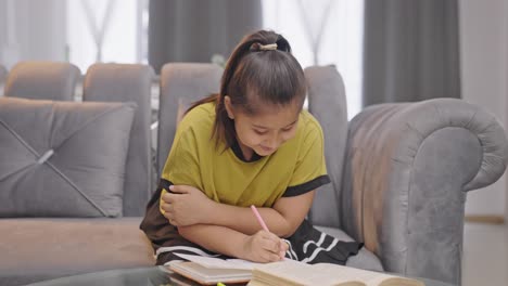 happy indian girl kid studying and learning