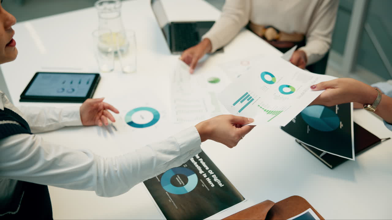 Business meeting discussing data analysis and marketing strategies