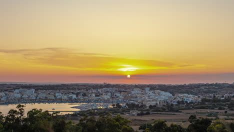 The-coastal-village-on-Marsaxlokk,-Malt-at-sunset---picturesque,-golden-time-lapse