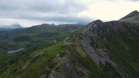 Aerial-view-over-a-rough-Scandinavian-mountainside-with-glimpses-of-water