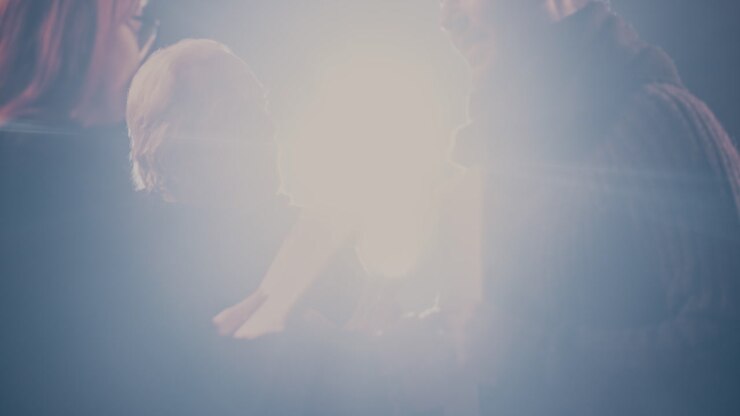 Aged Director Watching Actors Performing Romantic Scene Pan around View of Senior Stage Director Watching Man and Woman with Scripts Rehearsing Romantic Scene in Spotlight in Theater