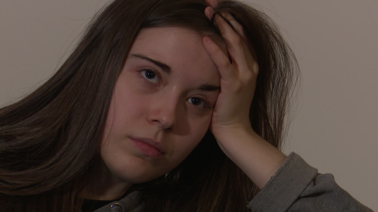 Young woman looking bored