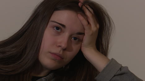 young woman looking bored