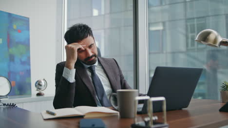 desperate businessman looking laptop reading bad news close up. unhappy manager