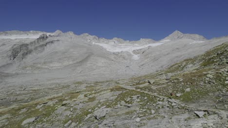 Drone-captures-a-man-during-a-summer-trekking-in-South-Ttyrol