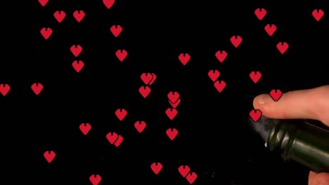 Multiple-red-heart-icons-floating-against-hand-popping-a-champagne-cork-against-black-background