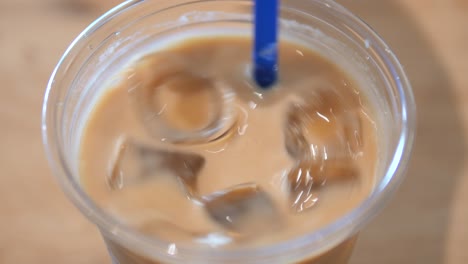 iced coffee in plastic cup with straw