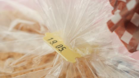 bread in plastic packaging with date code