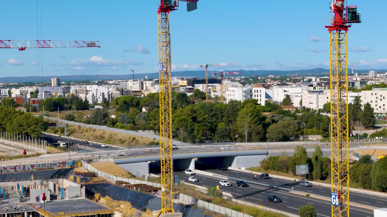 Aerial shot of cranes working at developing the Odysseum tramway in France
