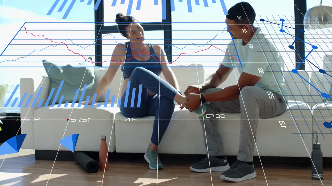 Woman extending leg to man, man inspecting, securing ankle strap for rehab, blue charts overlaying