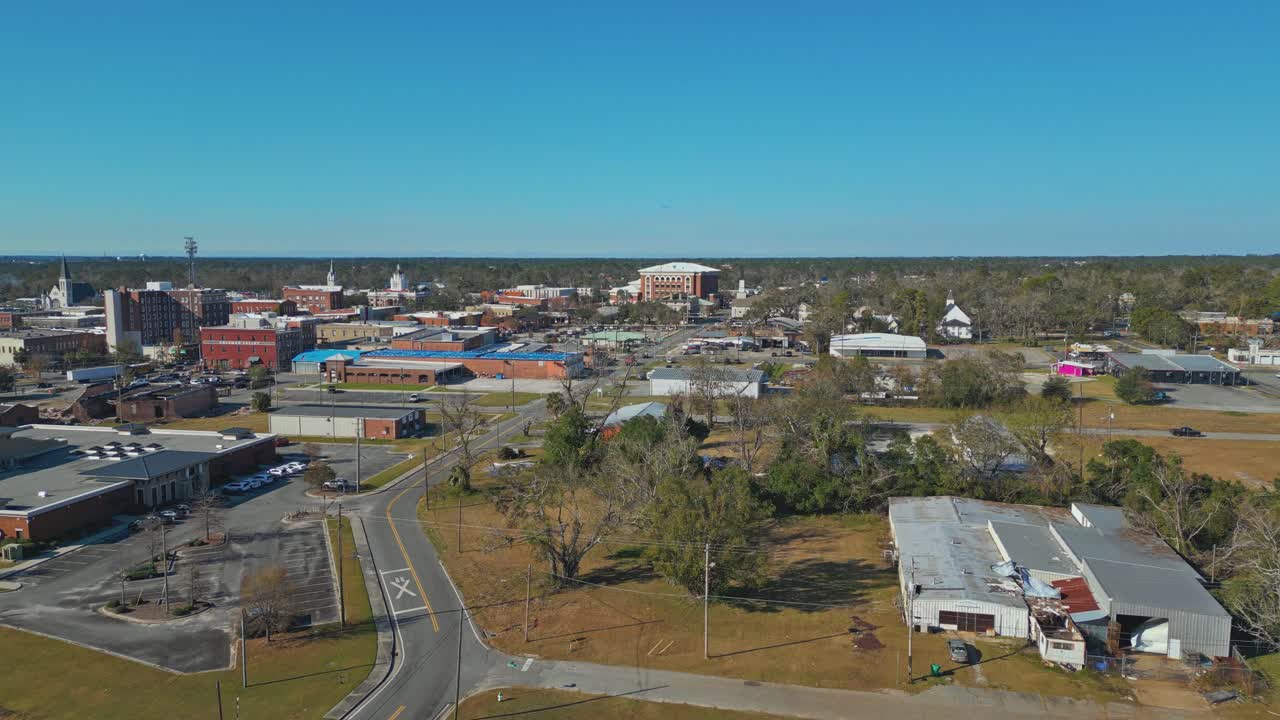 Aerial View Of Valdosta City On Sunny Day In Georgia, USA. Lowndes County Government Office Building In Distance. pullback shot