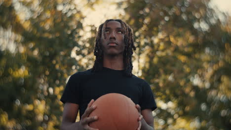 young man holding a basketball