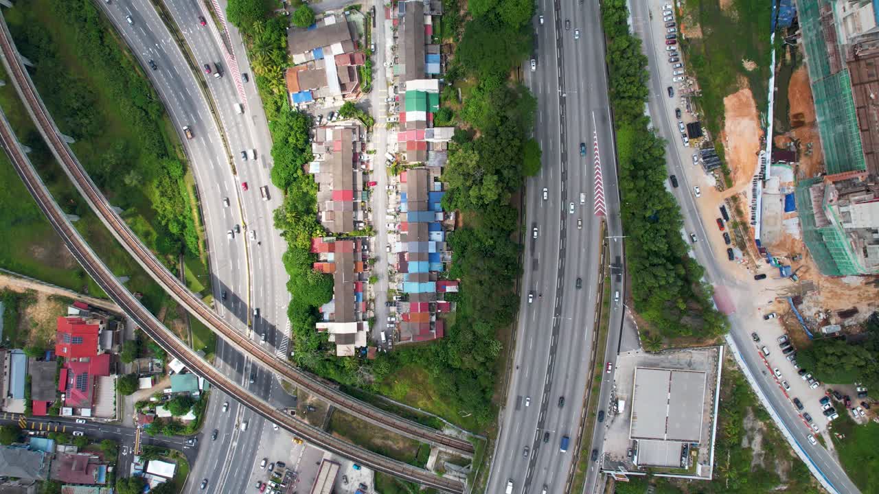 Aerial view of highways, roads, buildings, and urban areas