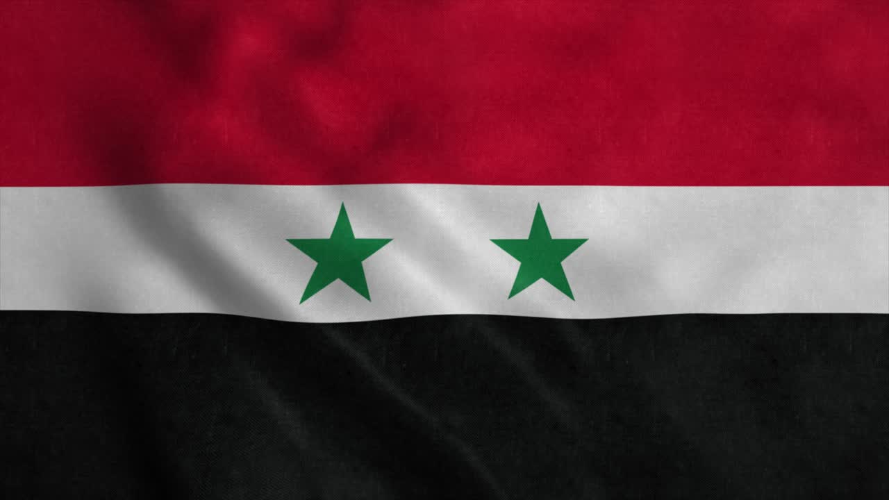 The national flag of Syria flutters in the wind