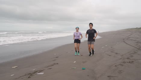 couple running on the beach