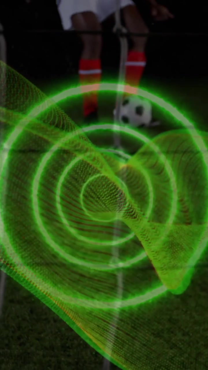 Animazione di una scia luminosa a spirale contro la parte centrale di un calciatore che calcia un rigore
