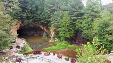 4k drone video of cave and waterfall at emerald village near little switzerland, nc on summer day-3